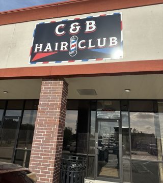 Front entrance of C & B Hair Club, featuring a welcoming door and signage for the hair salon.